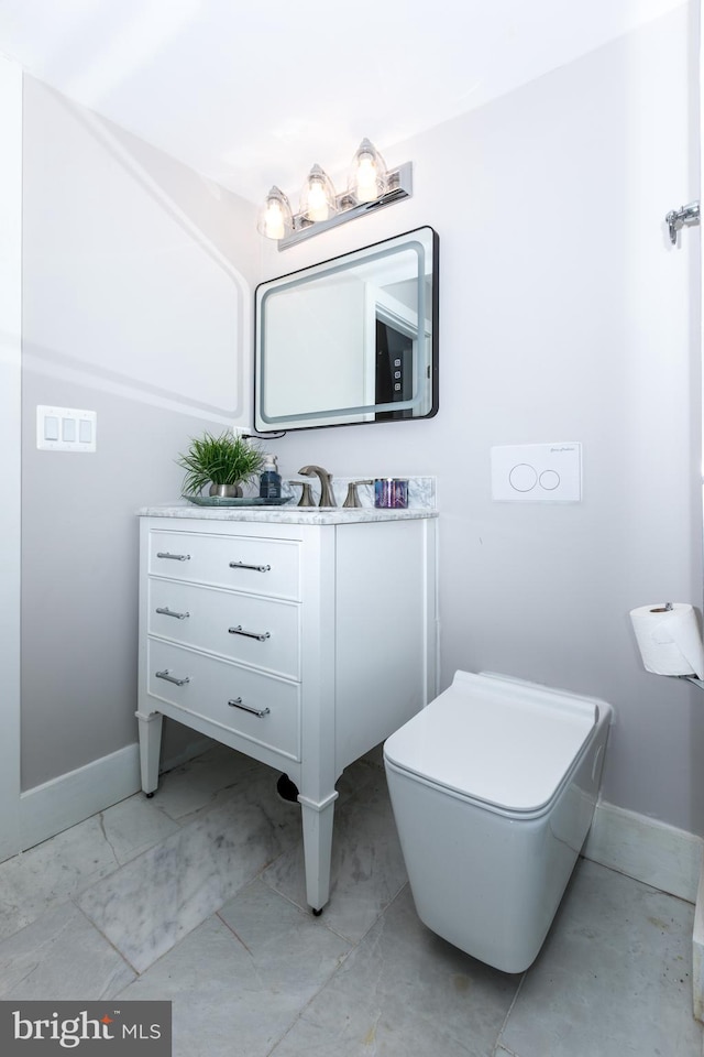 bathroom with large vanity, tile flooring, and toilet