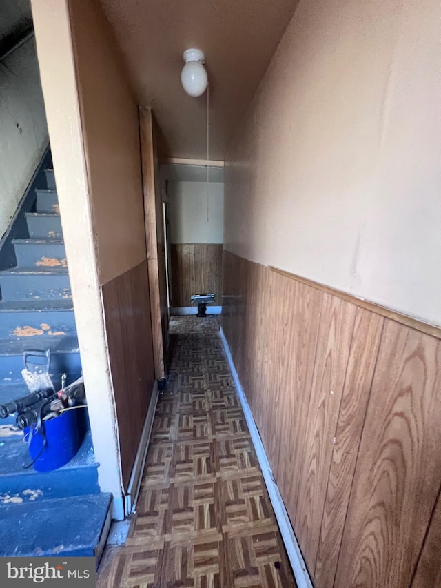 hallway with dark parquet floors