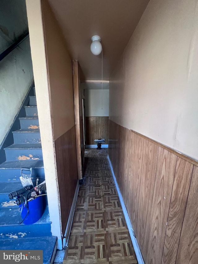 corridor featuring dark parquet flooring