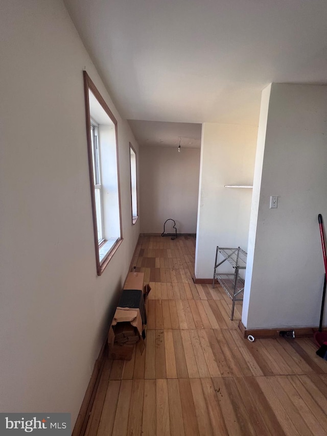 hallway with light wood-type flooring