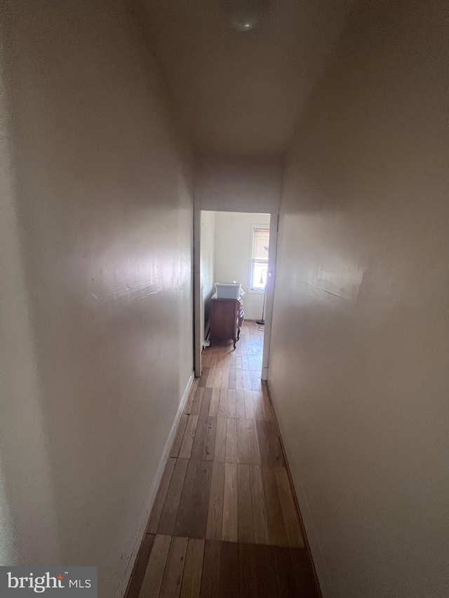 corridor featuring dark hardwood / wood-style floors