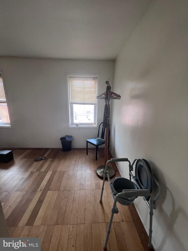 exercise room with hardwood / wood-style flooring