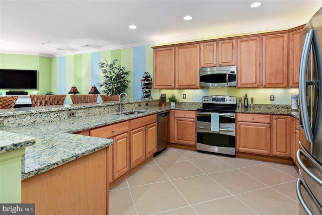 kitchen featuring stainless steel appliances, light tile floors, light stone countertops, kitchen peninsula, and sink