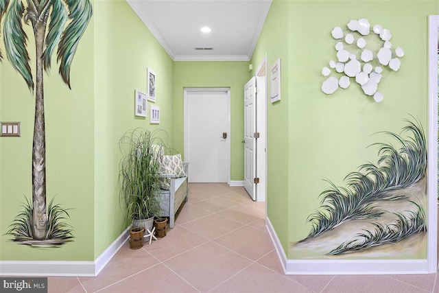 hallway featuring crown molding and light tile floors