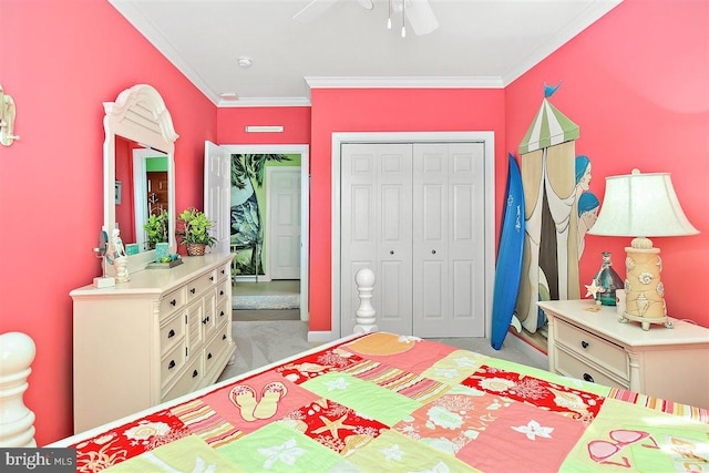 carpeted bedroom with a closet, ceiling fan, and ornamental molding