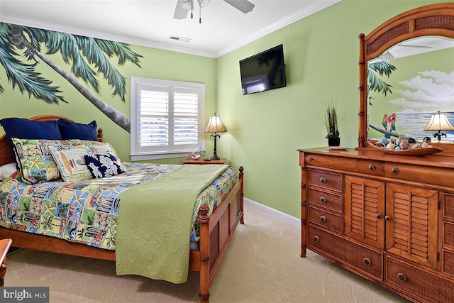 bedroom with ornamental molding, light colored carpet, and ceiling fan