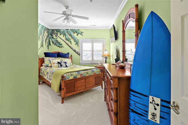 bedroom with light carpet, ornamental molding, and ceiling fan