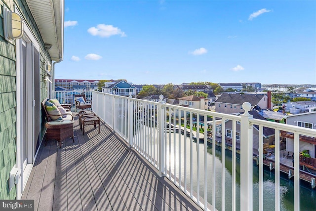 balcony featuring a water view