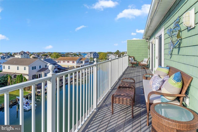 balcony featuring a water view