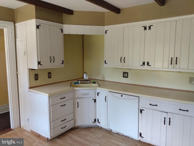 kitchen featuring dishwasher, sink, beamed ceiling, light hardwood / wood-style floors, and white cabinetry