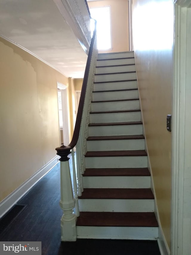 stairway featuring hardwood / wood-style flooring