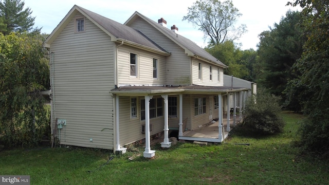 exterior space featuring a front yard and covered porch