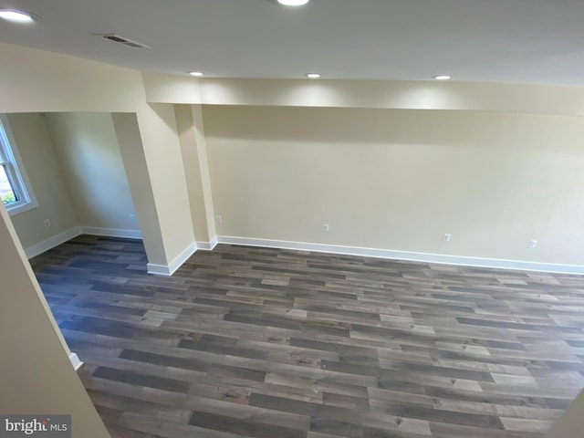 basement featuring dark wood-type flooring