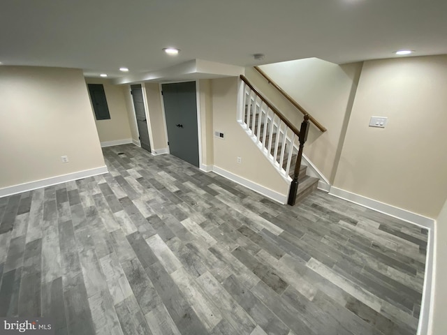 basement featuring wood-type flooring