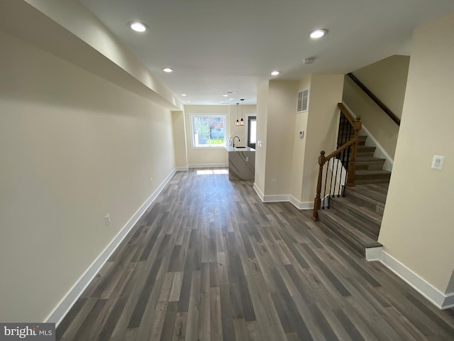 corridor with dark wood-type flooring