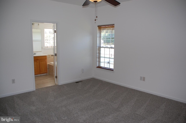 interior space featuring ceiling fan