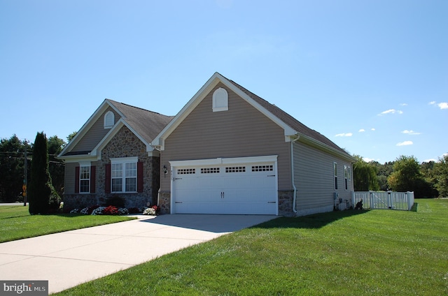 view of front of house with a front lawn and a garage