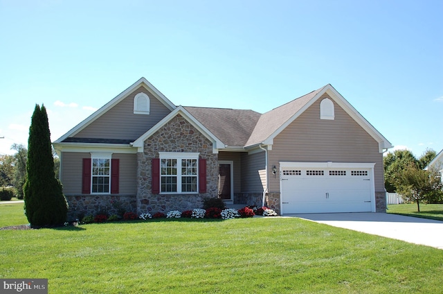 view of front facade with a front yard and a garage