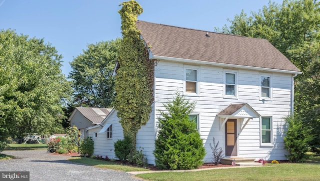 view of front of property with a front lawn