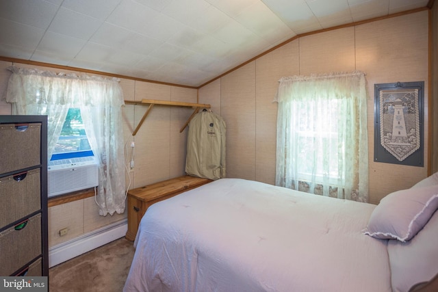 carpeted bedroom with a baseboard radiator, multiple windows, and lofted ceiling