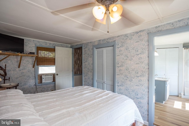 bedroom with ceiling fan and light hardwood / wood-style flooring