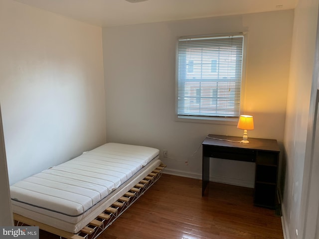 bedroom featuring dark wood-type flooring