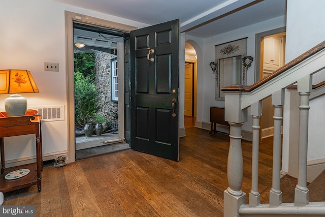 foyer entrance with dark hardwood / wood-style floors