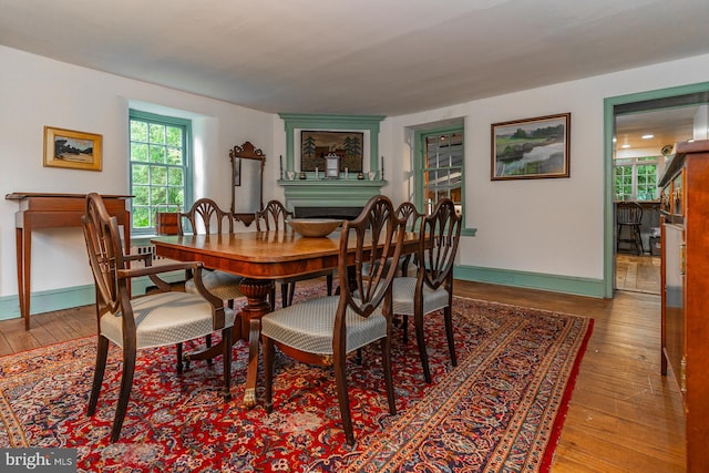 dining space with dark hardwood / wood-style floors