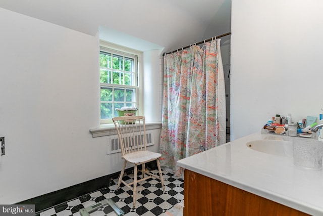 bathroom with vanity and tile flooring