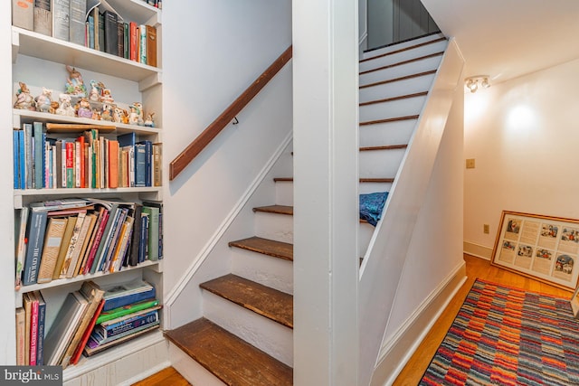 stairway featuring light hardwood / wood-style flooring