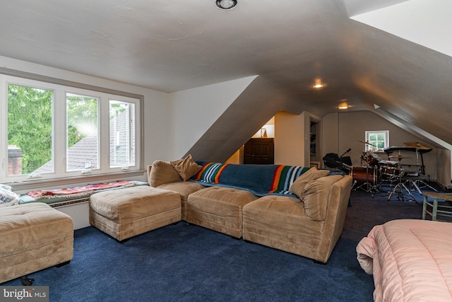 living room with vaulted ceiling, dark colored carpet, and a wealth of natural light