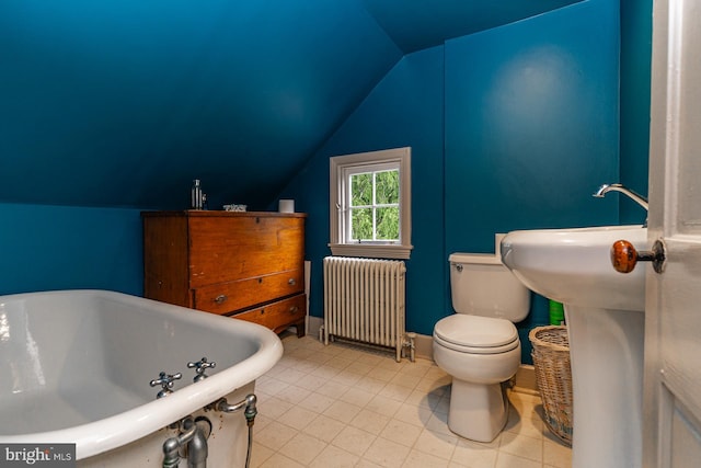 bathroom with toilet, radiator heating unit, a bath, lofted ceiling, and tile floors