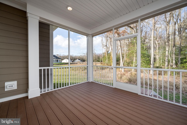 unfurnished sunroom with plenty of natural light