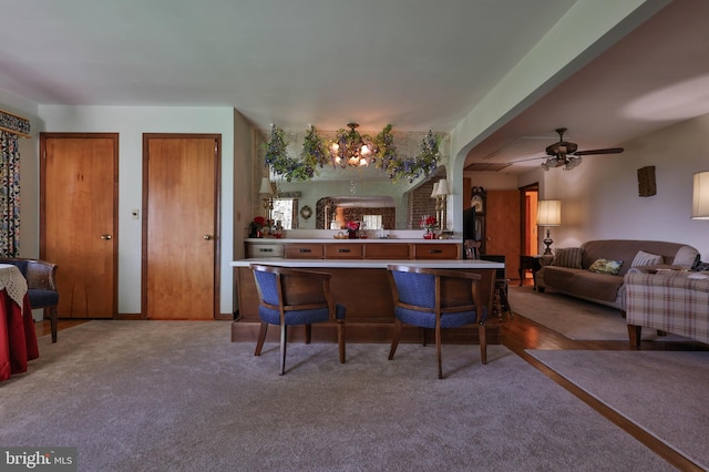 interior space featuring carpet flooring and ceiling fan