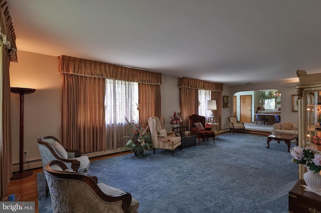 living room featuring a baseboard heating unit