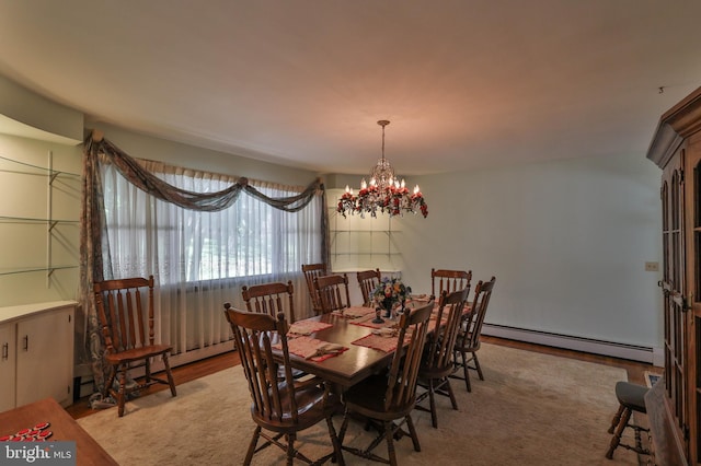 dining room with a baseboard radiator and an inviting chandelier