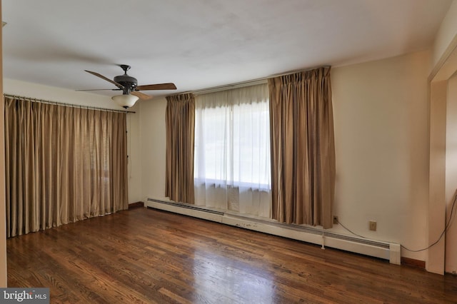 unfurnished room featuring ceiling fan, baseboard heating, and dark wood-type flooring