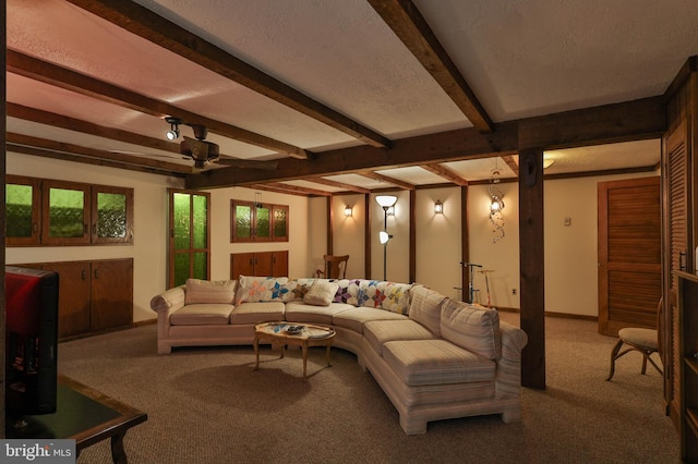 carpeted living room featuring a textured ceiling and beamed ceiling