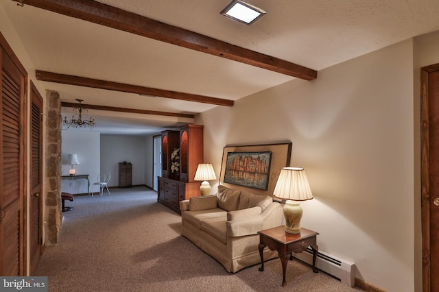 carpeted living room featuring baseboard heating, a notable chandelier, and beam ceiling