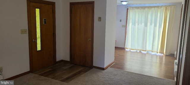 corridor with dark wood-type flooring