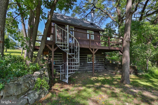 rear view of property with a deck