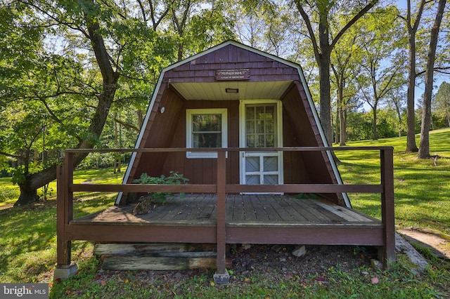 exterior space with a deck and a yard