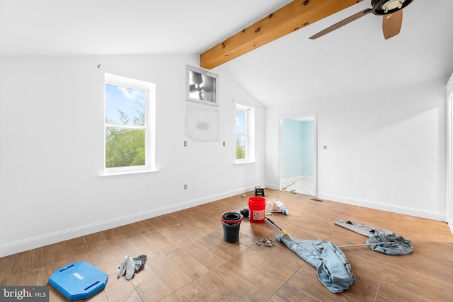 workout area with hardwood / wood-style flooring, lofted ceiling, ceiling fan, and a wealth of natural light