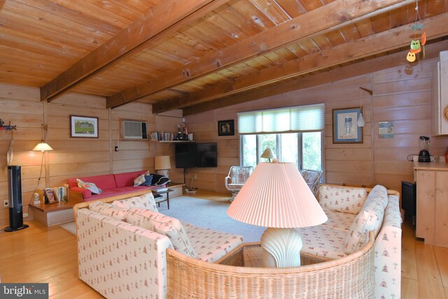 living room with wood ceiling, beamed ceiling, wood walls, and light hardwood / wood-style floors