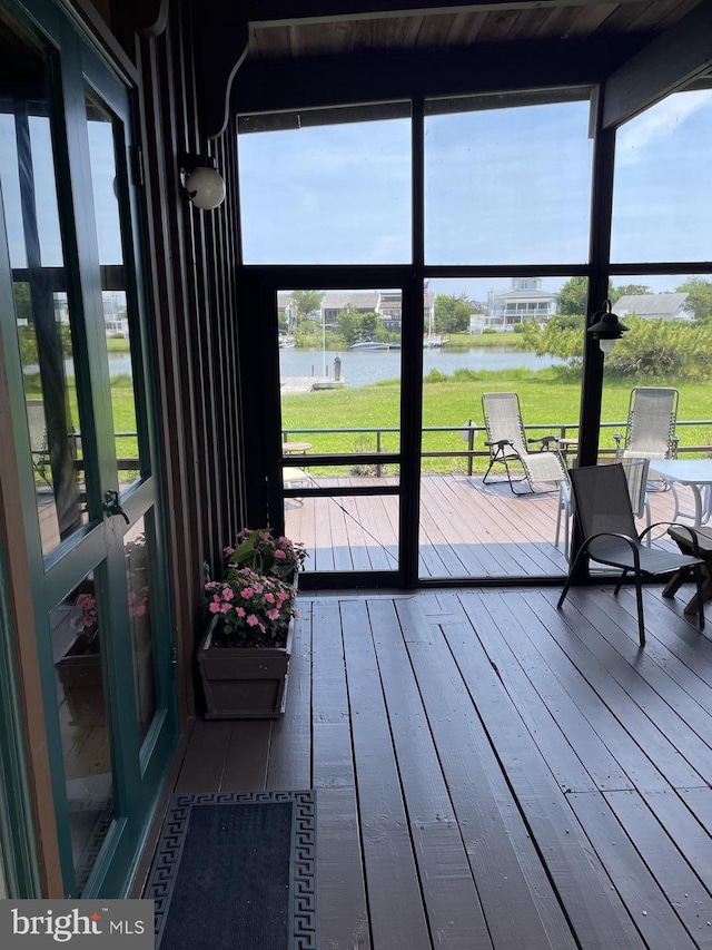 sunroom with a water view