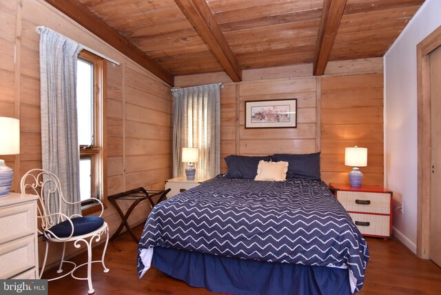 bedroom featuring wood walls, dark wood-type flooring, and beamed ceiling