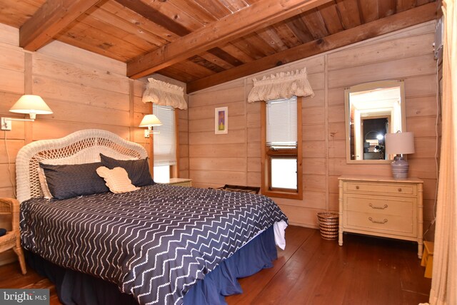 bedroom with wooden walls, wood ceiling, dark hardwood / wood-style flooring, and beamed ceiling