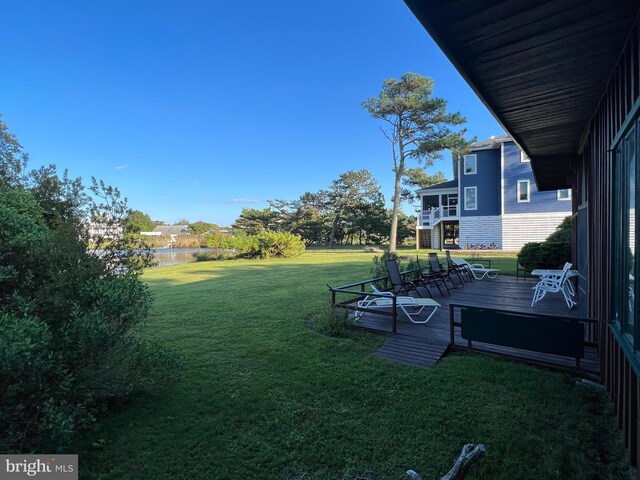 view of yard with a wooden deck