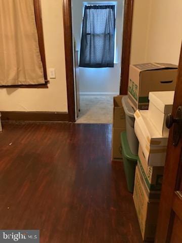 corridor featuring dark hardwood / wood-style flooring