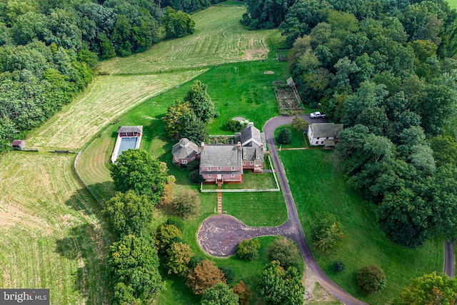 birds eye view of property with a rural view